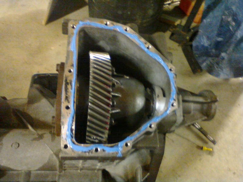 The ring gear is meshed with the transfer gear, and the carrier floats between the diff retainers. The rebuild kit did not come with a gaskets for the covers, and the instructions call for RTV anyway.